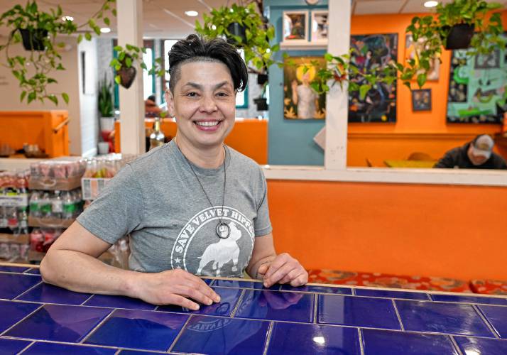 Amy McMahan sits at the bar of her restaurant Mesa Verde in Greenfield, which is expected to provide 3,140 hot meals to participants in the Franklin County Community Meals Program over the course of the year. Although Mesa Verde will be closing to transform into a food lab, McMahan said she will continue her mission of supporting folks through food.