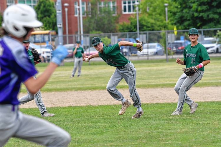 Greenfield’s Caleb Thomas throws out a Westfield Tech runner at first after fielding the ball bare handed during an MIAA Div. 5 Round of 16 game at Veterans Field in Greenfield on Tuesday. At right is Arthur Fitzpatrick. 