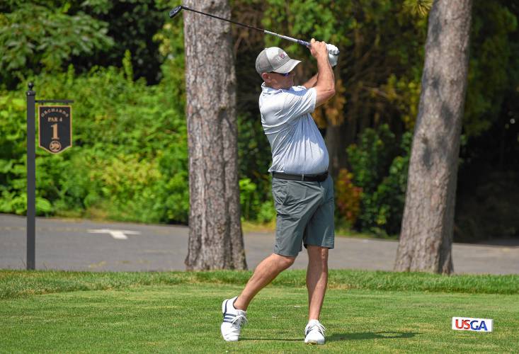 South Deerfield’s Keith Burch watches his tee shot on the first hole during qualifying for the 2025 U.S. Amateur Four-Ball Championship held at Orchards Golf Club in South Hadley on Monday.
