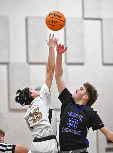 Pioneer’s Alex McClelland and Smith Academy’s Jake Wilcox tip off the game in Northfield Wednesday. 