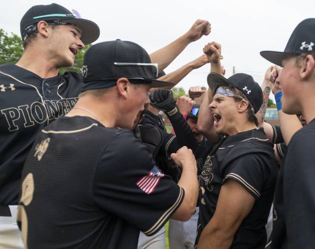 Pioneer players break from a huddle after winning the PVIAC Class D championship game against Hopkins Academy 4-2 at Mackenzie Stadium, Wednesday, May 28, 2025, in Holyoke.