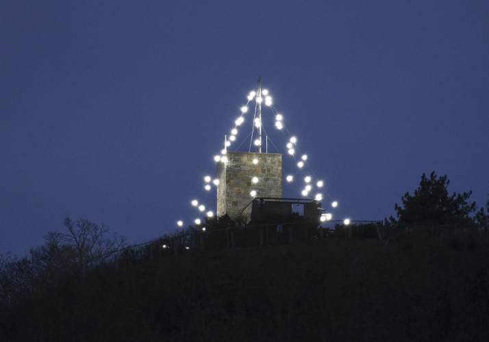 The holiday lights atop Mount Sugarloaf in South Deerfield, a 75-year tradition, are seen from Whately.