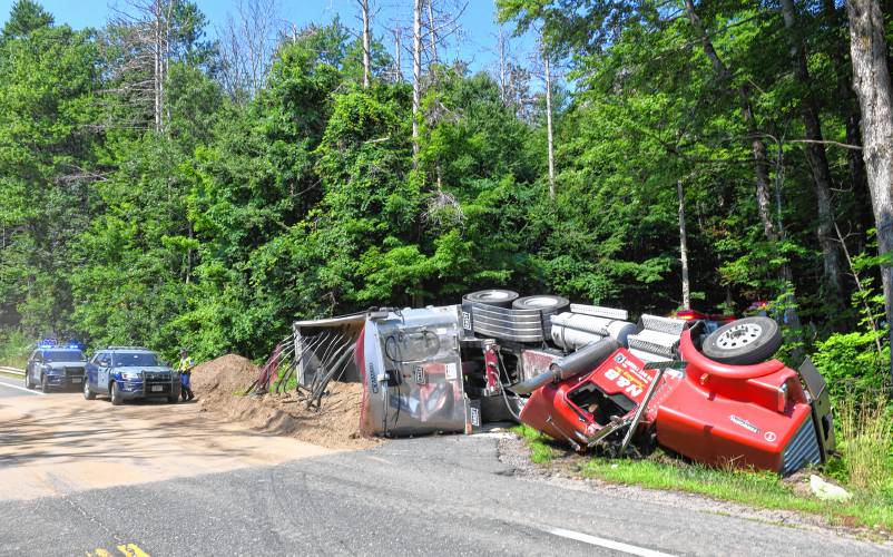 A tractor-trailer truck hauling a load of dirt crashed at the base of Prescott Road in Shutesbury on Monday morning, dumping part of the load onto Daniel Shays Highway (Route 202). According to officers on scene, the driver reportedly escaped any serious injuries, but the trailer blocked Prescott Road completely, rerouting traffic in Shutesbury Center.