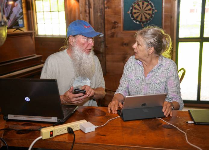 Warwick Town Coordinator David Young helps resident Mary Humphries hook up a bluetooth keyboard to her iPad during a technology help session at the Warwick Inn on Thursday. Residents searching for help with technology or just looking to socialize while enjoying a cup of coffee will be welcome at the Warwick Inn through a pair of new programs.