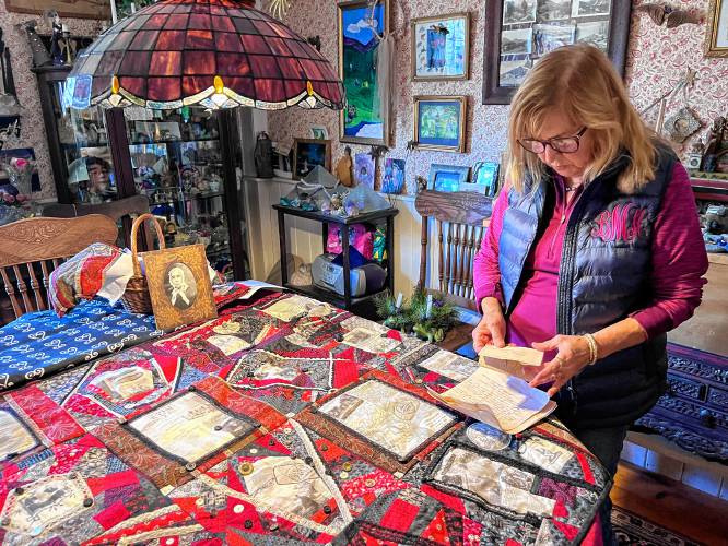 Historian Bambi Miller with the “Ladies Moral Compass Quilt,” which residents can see during a program at Tyler Memorial Library in Charlemont on Thursday, Jan. 16.