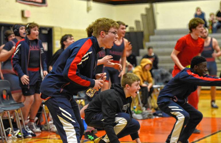 Mahar wrestlers celebrate a pin during the Senators’ 54-29 win over South Hadley on Tuesday night in South Hadley.