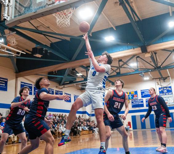 Granby's Sawyer Clarke (0) attempts a layup during the PVIAC Class C tournament semifinal game against Mahar at Granby High School, Tuesday, Feb. 18, 2025, in Granby.
