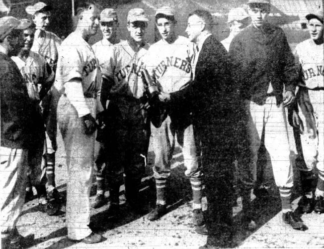 In this photo from the June 22, 1942 edition of the Recorder, Boston scribe “Doc” Mooney presents coach Earl Lorden with the championship trophy after Turners Falls beat Arlington to win the 1942 state championship at Fenway Park in Boston. Along with Lorden are catcher Harvey ‘Henic’ Welcome, Paul Whiteman, Tanny Bourdeau, Artie Burke and George Bush. In this photo from the June 22, 1942 edition of the Recorder, Boston scribe “Doc” Mooney presents coach Earl Lorden with the championship trophy after Turners Falls beat Arlington to win the 1942 state championship at Fenway Park in Boston. Along with Lorden are catcher Harvey ‘Henic’ Welcome, Paul Whiteman, Tanny Bourdeau, Artie Burke and George Bush.