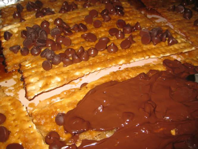 Assembling the Matzo Crunch. Years ago, I was tickled to find a sweet confection at an upscale grocery store: Matzo Crunch. This expensive and delicious treat combined matzo, buttery brown sugar and chocolate. I fell deeply in love.
