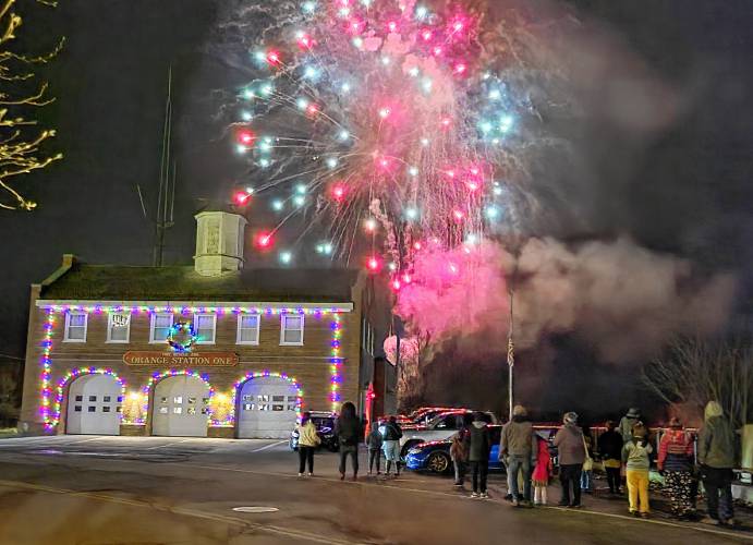 Spectators watch the fireworks near the Fire Station during Orange’s Starry Starry Night New Year’s Eve celebration in 2023.