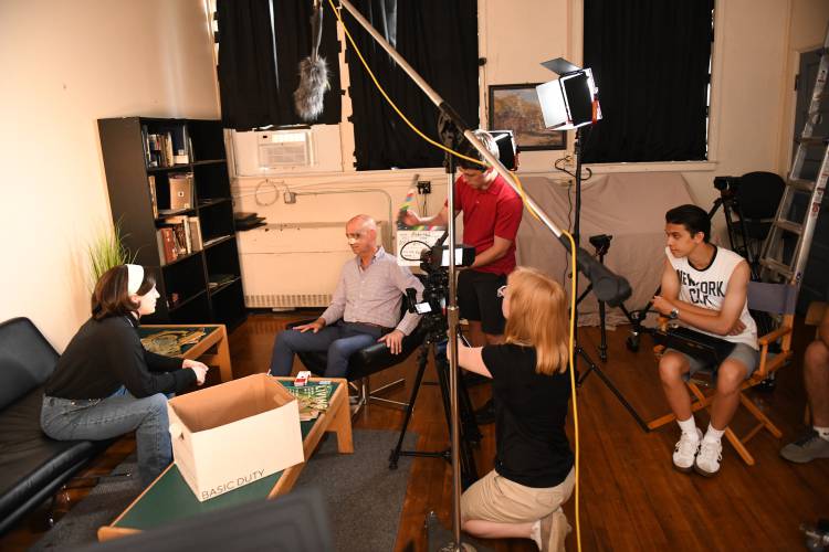 Actors Cynthia Lupo and John Basile with crew members Ben Roberts and Emily Laus and director Connor Mabius filming a scene in “Averted.”