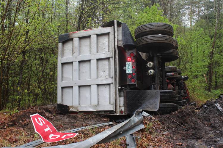 A man was taken by ambulance to Baystate Medical Center in Springfield on Monday after the 18-wheeler he was driving careened through the intersection of Daniel Shays Highway (Route 202) and Prescott Road in Shutesbury, crashed through a guardrail and rolled onto its side.
