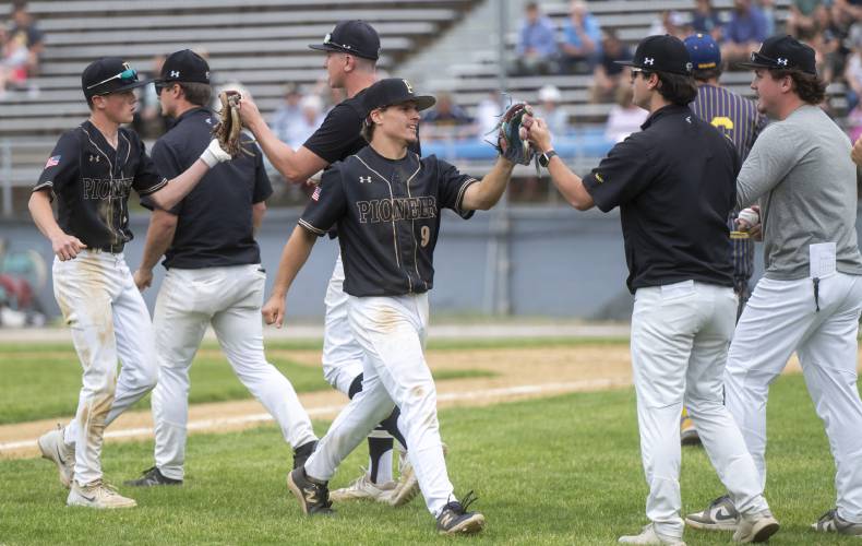 Pioneer's Ethan Quinn (9) is high-fived after closing out an inning during the PVIAC Class D championship game against Hopkins Academy at Mackenzie Stadium, Wednesday, May 28, 2025, in Holyoke.