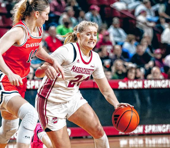 UMass guard Allie Palmieri (24) drives toward the hoop against Davidson’s Kyra Bruyndoncx (14) during the first half of the Minutewomen’s 56-38 loss to the Wildcats on Saturday afternoon at Mullins Center.