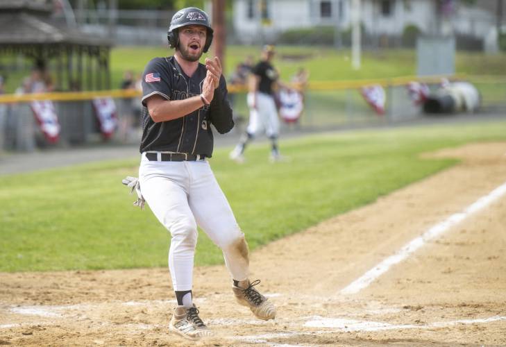 Pioneer's Braeden Tsipenyuk claps after scoring a run during the PVIAC Class D championship game against Hopkins Academy at Mackenzie Stadium, Wednesday, May 28, 2025, in Holyoke.