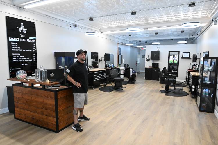 Co-owner David Righini in The Angel’s Edge Barbershop on Federal Street in Greenfield.
