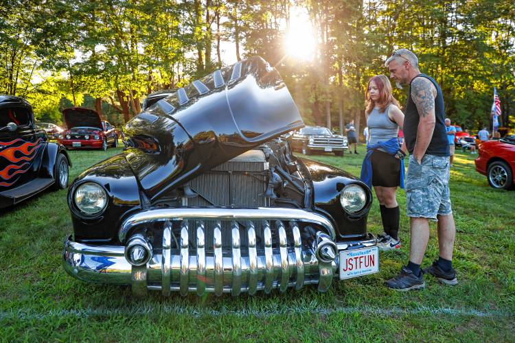 Nate Hubbard and his daughter Cara, 11, check out a 1952 Buick, one of the 151 antique vehicles in attendance during the weekly Cruise Night on Friday at Tom’s Long Hot Dogs in Whately. The show takes place every Friday night, from 5 p.m. until dusk, through Sept. 6, weather permitting. There are no rain dates. Tom’s is located at 61 State Road.