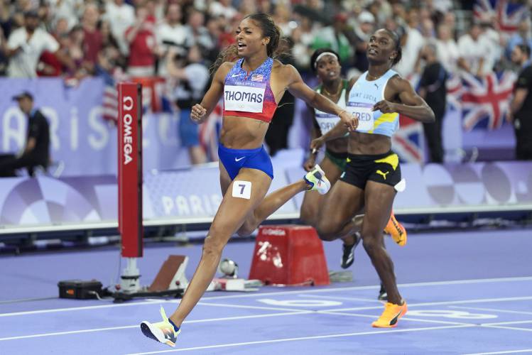 Florence’s Gabby Thomas celebrates after winning the women's 200-meter final at the 2024 Summer Olympics, Tuesday, Aug. 6, 2024, in Saint-Denis, France.