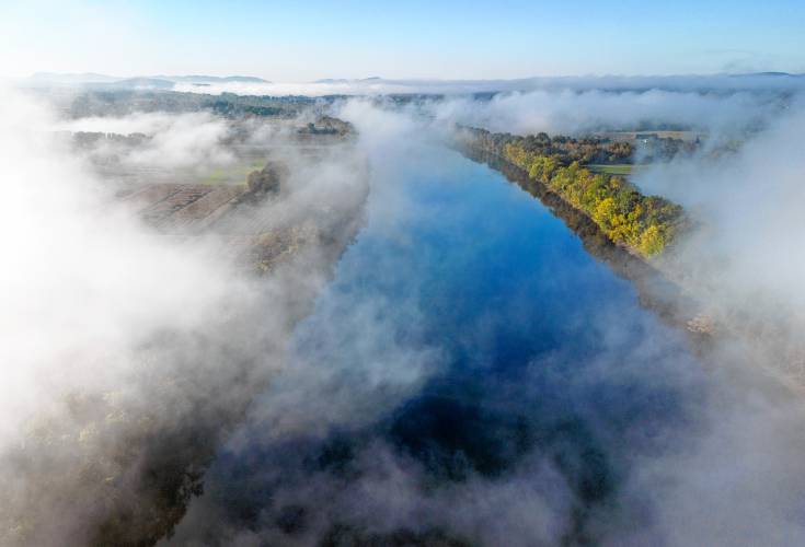 Fog rolls through across the valley over the Connecticut River in the early morning in Sunderland. Fog rolls through across the valley over the Connecticut River in the early morning in Sunderland.