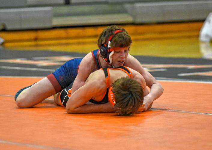 Mahar’s Orion Whitehouse (blue) takes control of the 126-pound match against South Hadley’s Ryan LaChance during the Senators’ 54-29 win over the Tigers on Tuesday night in South Hadley.