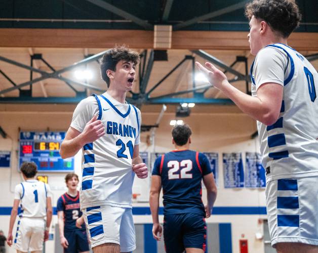 Granby's Gavin Moreno (21) and Sawyer Clarke (0) discuss the confusion on a previous play during the PVIAC Class C tournament semifinal game against Mahar at Granby High School, Tuesday, Feb. 18, 2025, in Granby.