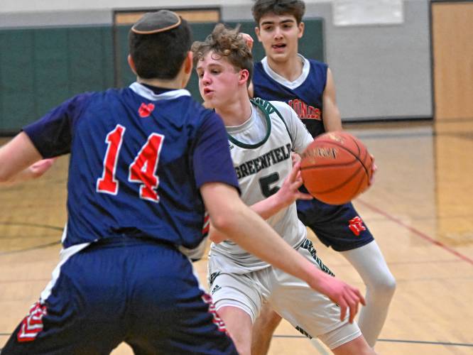 Greenfield’s Grayson Thomas gets ready to shoot against Maimonides  during a preliminary round contest of the MIAA Div. 4 state tournament on Tuesday at Nichols Gymnasium. 