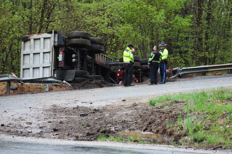 A man was taken by ambulance to Baystate Medical Center in Springfield on Monday after the 18-wheeler he was driving careened through the intersection of Daniel Shays Highway (Route 202) and Prescott Road in Shutesbury, crashed through a guardrail and rolled onto its side.
