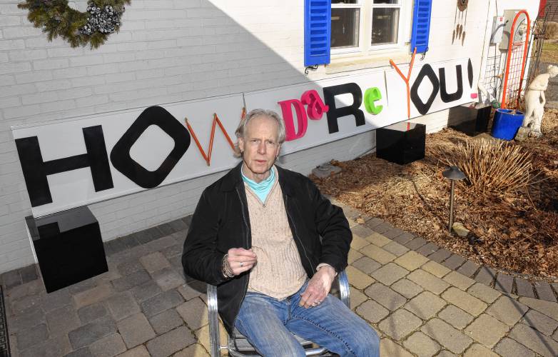 Joseph “JJ” White with his latest creation at his Greenfield home.