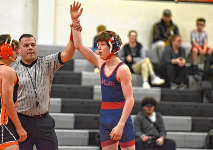 Mahar’s Orion Whitehouse has his arm raised by the official, declaring him the winner of the 126-pound match during the Senators’ 54-29 win over the Tigers on Tuesday night in South Hadley.