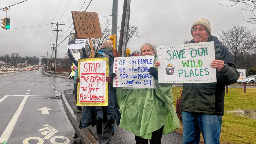George Regmund and Stephanie Chapko join a protest organized by Swing Left Western Mass in Hadley on Monday to show support for the fired and current U.S. Fish & Wildlife employees.