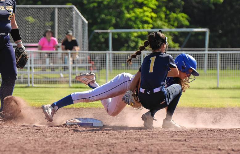 Turners Falls’ Anne Kolodziej tries to avoid the tag of Academy of Notre Dame’s Gianna Perna (1) during the Thunder’s victory in the MIAA Division 5 Round of 32 on Monday at Gary Mullins Field in Turners Falls.