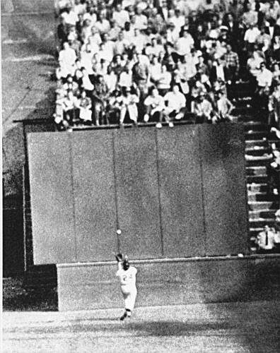 Running at top speed with his back to the plate, New York Giants center fielder Willie Mays gets under a 450-foot blast by Cleveland’s Vic Wertz for an over-the-shoulder basket catch in front of the bleachers wall in the eighth inning of the World Series opener at the Polo Grounds in New York on Sept. 29, 1954.