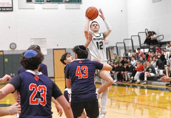 Greenfield’s Caleb Thomas takes a shot against Maimonides  during a preliminary round contest of the MIAA Div. 4 state tournament on Tuesday at Nichols Gymnasium. 