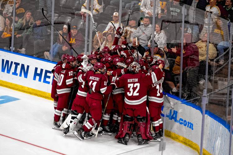 UMass players are all smiles after defeating Minnesota 5-4 in overtime on Thursday night in Fargo, N.D.