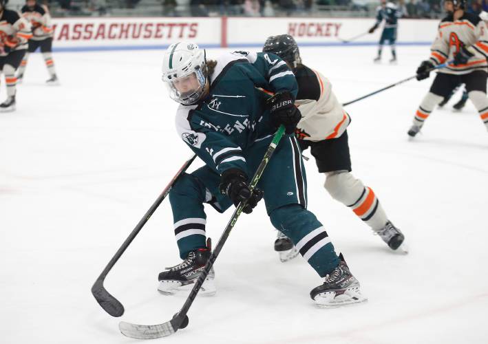 Greenfield’s Jake Jurek (2) maneuvers the puck past Belchertown’s Oliver Young at the UMass Mullins Center Community Rink in Amherst this past season.