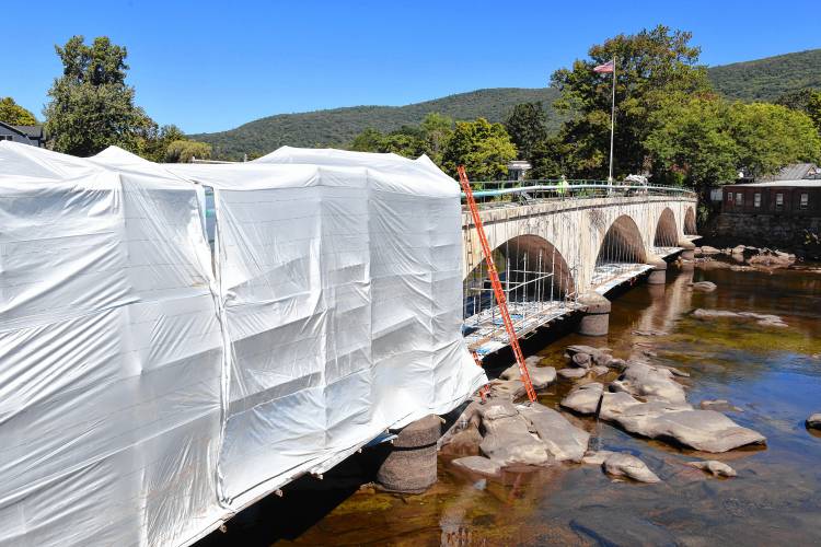 Funded by roughly $3.2 million from MassWorks, Northern Construction Service LLC of Palmer is working on the Bridge of Flowers repair project in Shelburne Falls. A 2020 study by Tighe & Bond recommended addressing cracks and stabilizing the north spandrel wall. The study also noted that some of the rebar supporting the walls is failing. Funded by roughly $3.2 million from MassWorks, Northern Construction Service LLC of Palmer is working on the Bridge of Flowers repair project in Shelburne Falls. A 2020 study by Tighe & Bond recommended addressing cracks and stabilizing the north spandrel wall. The study also noted that some of the rebar supporting the walls is failing.