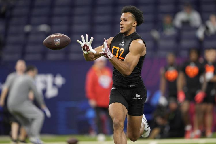 Former Deerfield Academy wide receiver Elic Ayomanor runs a drill at the NFL football scouting combine in Indianapolis, March 1. The Stanford product is expected to hear his name called at the NFL Draft this week.