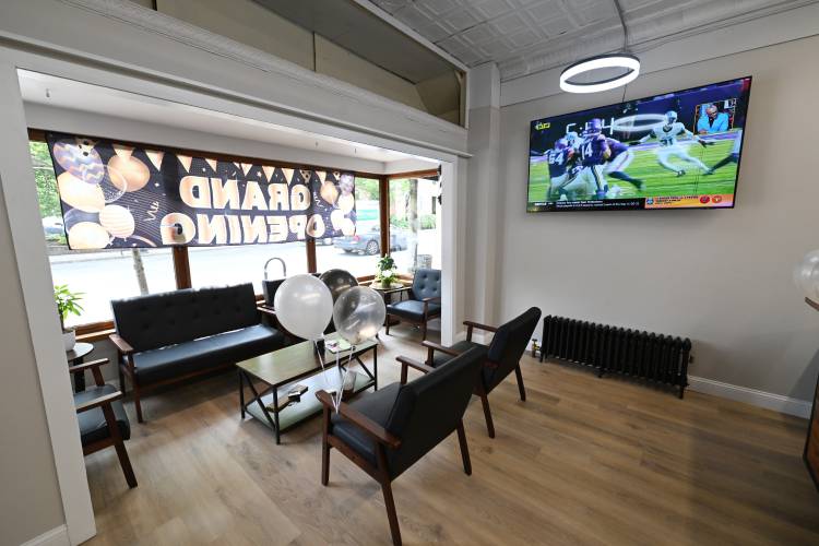 The waiting area in The Angel’s Edge Barbershop on Federal Street in Greenfield.