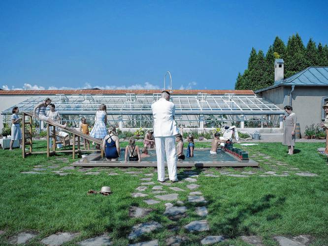 A pastoral idyll, despite a death camp in the background: Rudolph Höss (Christian Friedel), back to camera, observes his children and others playing in a scene from “The Zone of Interest.”