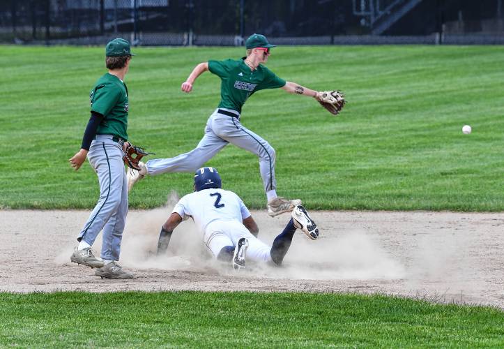 Boston English baserunner David Castillo takes second as Greenfield’s Arthur Fitzpatrick watches Caleb Thomas chase down the overthrow during the Green Wave’s 2-0 loss in the MIAA Division 5 semifinal round on Tuesday at Assumption University in Worcester.