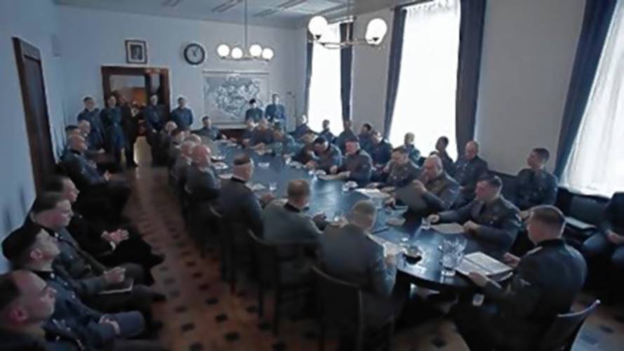 Nazi leaders of the concentration camp system meet in a scene from “The Zone of Interest.”