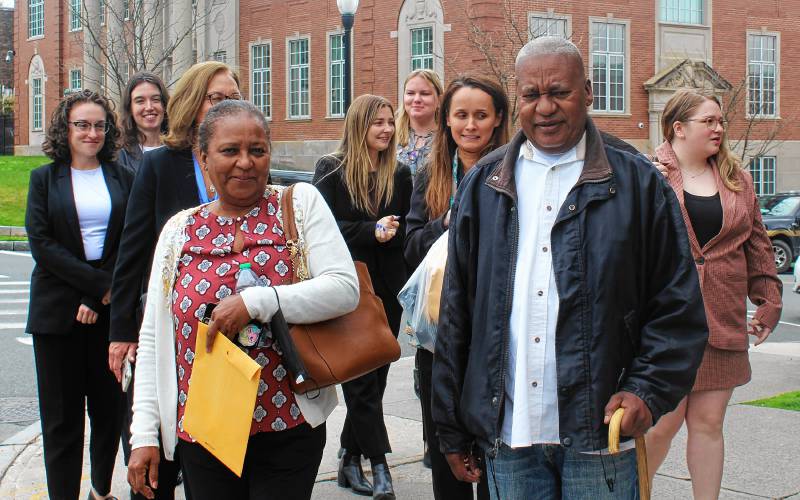 Elvio J. Marrero, right, strolls around the intersection of Main and Hope street in downtown Greenfield with his sister and members of the Boston College Innocence Program to test out his GPS monitoring device on Tuesday after posting $5,000 bail in Franklin County Superior Court. He has been in prison for a 1994 murder but the state Supreme Judicial Court on Jan. 11 ordered a new trial.