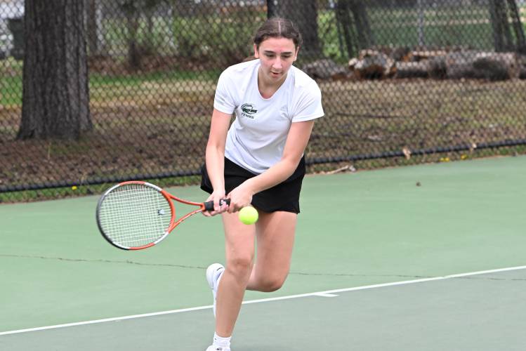 Greenfield’s Amy Mihailicenco returns a volley against Mohawk Trail’s Ryah Pizzi at the Davis Street Courts in Greenfield Friday.