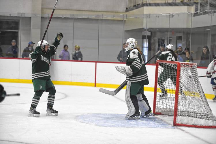 The Deerfield Academy girls hockey team goes to celebrate with goalie Campbell Krotee after winning the NEPSAC Large Division championship over Tabor Academy on Sunday at The Taft School in Watertown, CT.