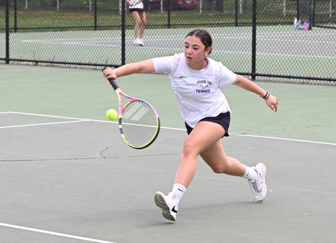 Mohawk Trail’s Ryah Pizzi returns a volley against Greenfield’s Amy Mihailicenco at the Davis Street Courts in Greenfield Friday.