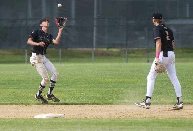 Pioneer's Alex McClelland, left, catches a fly ball during the PVIAC Class D championship game against Hopkins Academy at Mackenzie Stadium, Wednesday, May 28, 2025, in Holyoke.