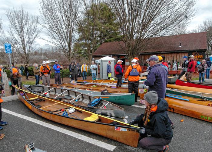 The winning boats are checked for length at the finish in Orange on Saturday after the 59th running of the River Rat Race.
