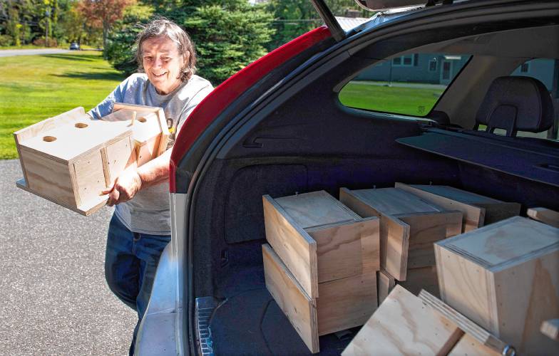 Naomi Sturtevant fills her car with birdhouses and doll chairs made by Kristin Healy of Chesterfield. Healy makes the items during the warm weather and then donates them to various causes. Sturtevant is taking these items to the Contentment Chapter of the Daughters of the American Revolution in Greenfield, which will sell them and give the proceeds to Colrain Central School. Naomi Sturtevant fills her car with birdhouses and doll chairs made by Kristin Healy of Chesterfield. Healy makes the items during the warm weather and then donates them to various causes. Sturtevant is taking these items to the Contentment Chapter of the Daughters of the American Revolution in Greenfield, which will sell them and give the proceeds to Colrain Central School.
