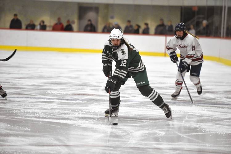 Deerfield Academy's Brady Wierl takes the puck up the ice against Tabor Academy during the NEPSAC Large Division championship on Sunday at The Taft School in Watertown, CT. 