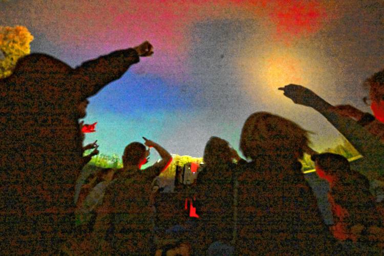 Colrain Central School students look at the evening sky as stars appear in an inflatable planetarium.